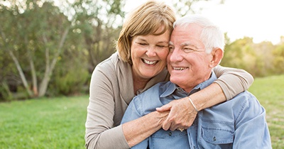 Older patient in Grafton with dental implants talking with their partner