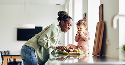 Mother and child enjoying snack together at home