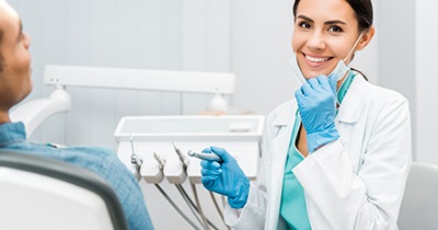 Dentist smiling at patient's dental exam